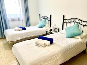 Łóżko lub łóżka w pokoju w obiekcie Villa 1B