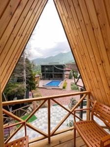 a view from the balcony of a house with a pool at Vaio Resort in Keda in Vaio