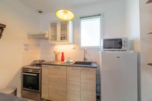 Η κουζίνα ή μικρή κουζίνα στο Appartement Vanneau - Welkeys