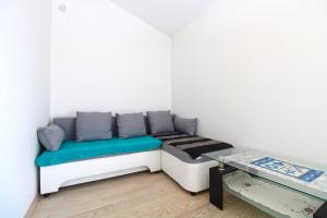 a small room with a bed and a table at House Volme 2255 in Banjole