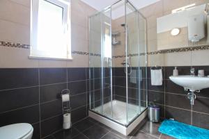 a bathroom with a shower and a sink at House Volme 2255 in Banjole +32 photos