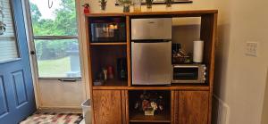 a kitchen with a refrigerator and a microwave at KD by the Sea in Kitty Hawk