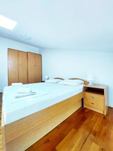 Postel nebo postele na pokoji v ubytování Apartmani Alavuk