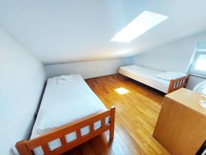 Postel nebo postele na pokoji v ubytování Apartmani Alavuk