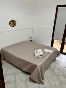 Postel nebo postele na pokoji v ubytování La Pergola B&B