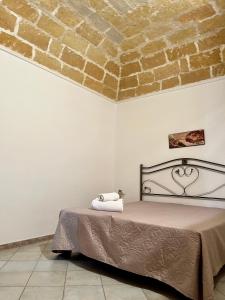 Postel nebo postele na pokoji v ubytování La Pergola B&B