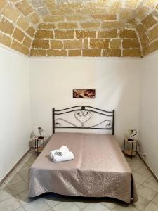 Кровать или кровати в номере La Pergola