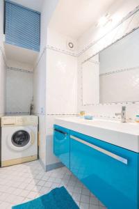 a bathroom with a washing machine and a sink at La Terrazza Amalfi in Amalfi