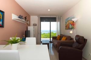 A seating area at 1112 Mileni I - Apivend Immo