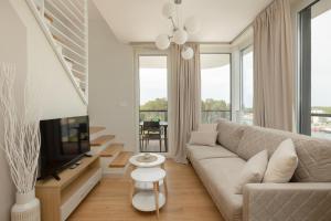 Posezení v ubytování Lighthouse Luxury Penthouse - Jantar Apartamenty