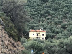 a house on the side of a mountain at Pelion Mountain & Sea Villa - Private Studio in Áno Gatzéa