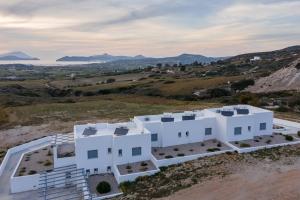 an aerial view of a white house on a hill at Sunset Village 5 in Paleochori