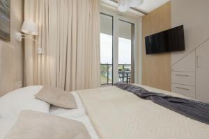 Postel nebo postele na pokoji v ubytování Lighthouse Luxury Penthouse - Jantar Apartamenty
