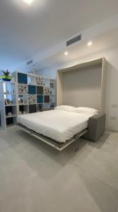 a bedroom with a large bed in a room at Casa d'aMare Polignano a mare in Polignano a Mare