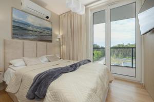 Postel nebo postele na pokoji v ubytování Lighthouse Luxury Penthouse - Jantar Apartamenty