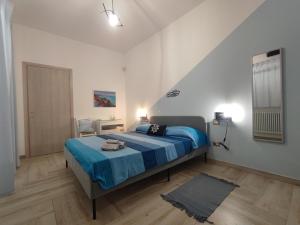 Postel nebo postele na pokoji v ubytování Sea Room Torre Lapillo