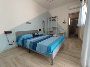 Postel nebo postele na pokoji v ubytování Sea Room Torre Lapillo