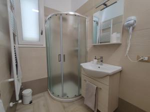 a bathroom with a shower and a sink at SEA ROOM A TORRE LAPILLO - Guest House in Torre Lapillo