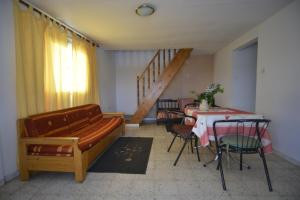 a living room with a couch and a table at Residence Panorama in Aïn Draham