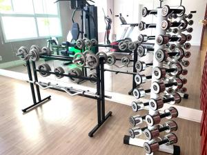 a gym with a rack of exercise equipment at Lindo Loft UNID 212 in Sao Paulo