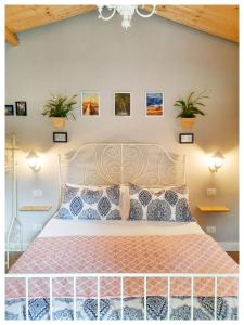 a bedroom with a bed with plants on the wall at La Casina in Trecasali