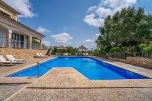a swimming pool in the backyard of a house at Ideal Property Mallorca - Sa Pleta in Petra