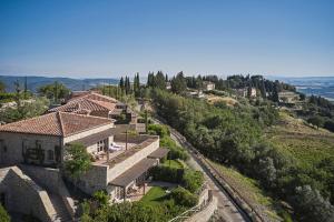 an aerial view of a house on a hill at Rosewood Castiglion del Bosco in Castiglione del Bosco