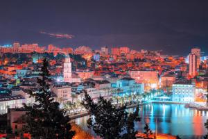 a city lit up at night with a river at Madea Split in Split