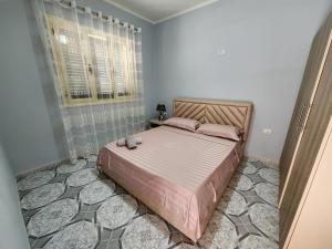 a bedroom with a large bed in a room at Villa Bleta in Vlorë