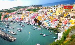 an aerial view of a harbor with boats in the water at "La Terrazza" Corricella in Procida