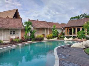 an image of a swimming pool in a villa at Spaces Bali Unique Boutique Hotel in Munggu