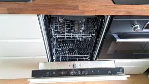 Kuchyňa alebo kuchynka v ubytovaní Apartmán Pálenica II