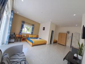 Postel nebo postele na pokoji v ubytování MrLee Dalat House