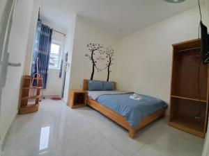 Postel nebo postele na pokoji v ubytování MrLee Dalat House