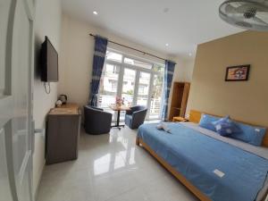 Postel nebo postele na pokoji v ubytování MrLee Dalat House