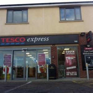 a tesco express store on the side of a building at Home in Alwoodley, Leeds