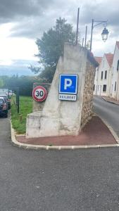 a parking sign on the side of a street at Grand studio refait à neuf ! in Yerres