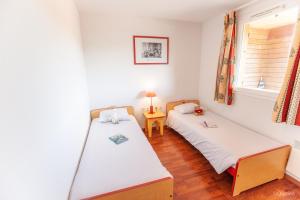 Un pat sau paturi într-o cameră la Olydea la Chalosse - Cassen