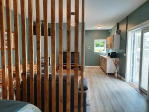 a living room with a wooden staircase in a house at Studio in Letterkenny