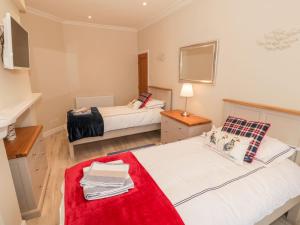 En eller flere senge i et værelse på Bay View