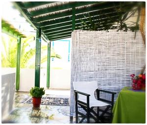 a patio with two chairs and a table at Georgios Milos in Adamantas