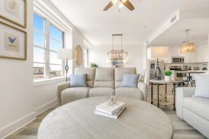 a living room with a couch and a table at Luxury 4 bedroom condo - Short Walk to Bourbon Street in New Orleans +40 photos