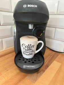 a coffee maker with a cup on top of it at Charmant Studio dans villa - jardin privatif . in La Seyne-sur-Mer