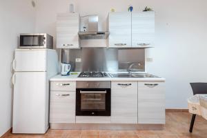 Kuchyň nebo kuchyňský kout v ubytování Casa Del Corso