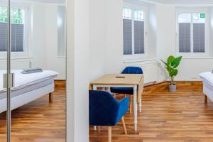 Postel nebo postele na pokoji v ubytování CBlue "Apartments am Hauptbahnhof" + 13 fotografií