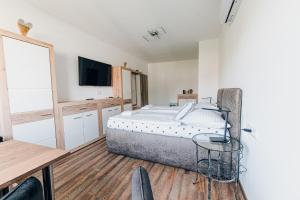 Posteľ alebo postele v izbe v ubytovaní Point Pension
