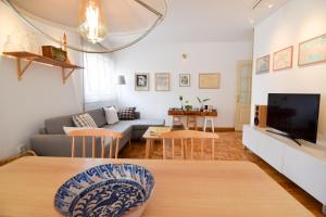 Televízia a/alebo spoločenská miestnosť v ubytovaní Letmalaga Casa Gibralfaro
