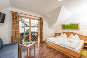 Postel nebo postele na pokoji v ubytování Das kleine Bio Hotel Tiefenbach