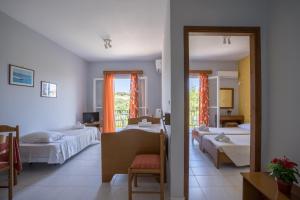 Postel nebo postele na pokoji v ubytování Ammousa Hotel Apartments