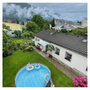 an overhead view of a backyard with a swimming pool at Ingrid’s Guesthouse Spittal in Spittal an der Drau